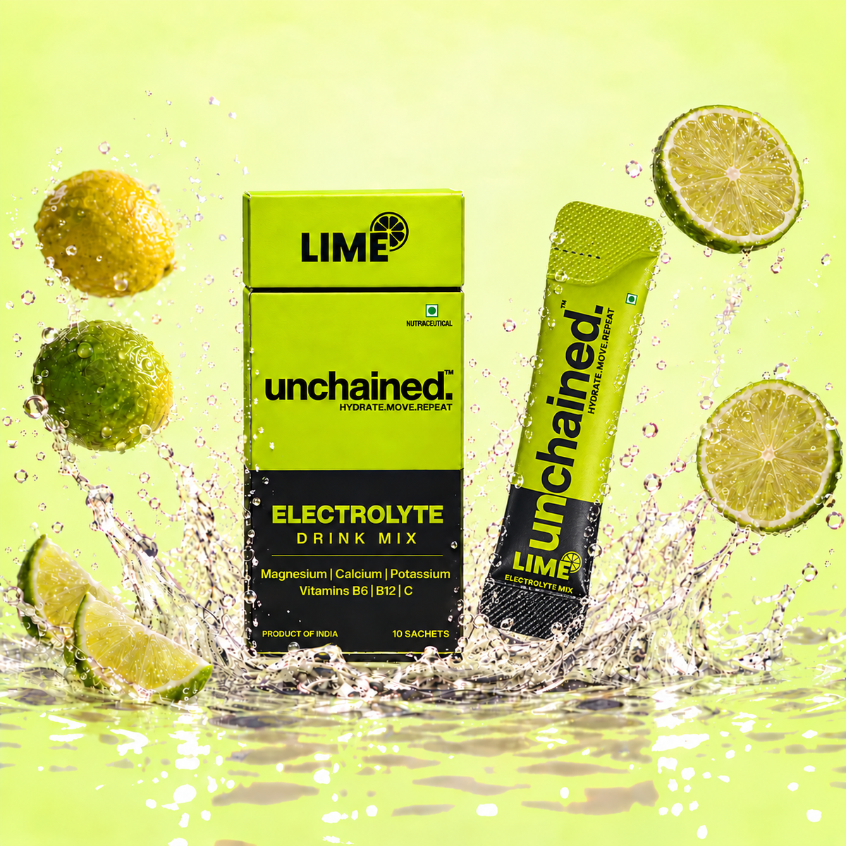 Unchained Lime Electrolyte Drink Mix 10-stick box and stick surrounded by fresh lime slices and water splash